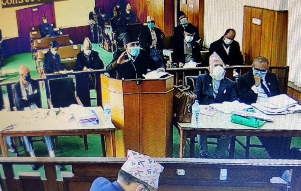 न्यायाधीशको प्रश्न: पार्टी एकीकरण नभई प्रधानमन्त्री कसरी बहुमत प्राप्त दलको नेता भए ?’